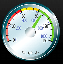 The image depicts a truck air pressure gauge with the needle pointing at 97 PSI, which is also indicated in kilopascals as approximately 669 kPa. The gauge features a multicolored scale with zones marked in red, yellow, and green, symbolizing different levels of air pressure safety and efficiency.